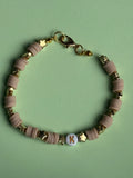 Beige lettered bracelet with a 'K'
