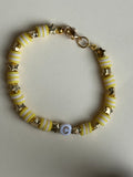Yellow and white lettered bracelet with a 'C' size 17cm
