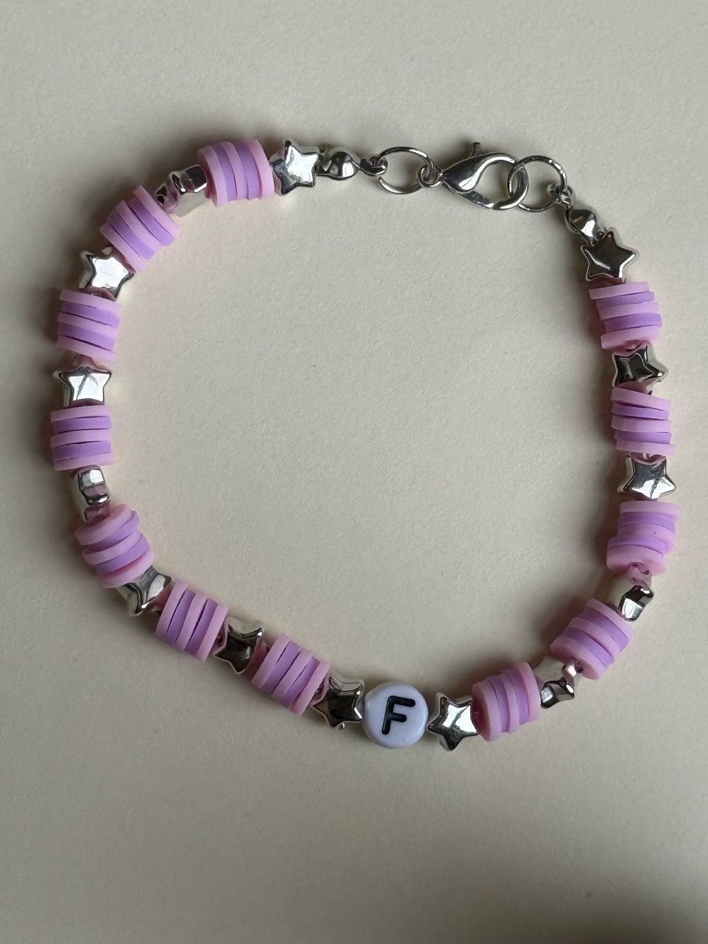 Pink and purple beads, silver stars and letter 'F' size 18cm
