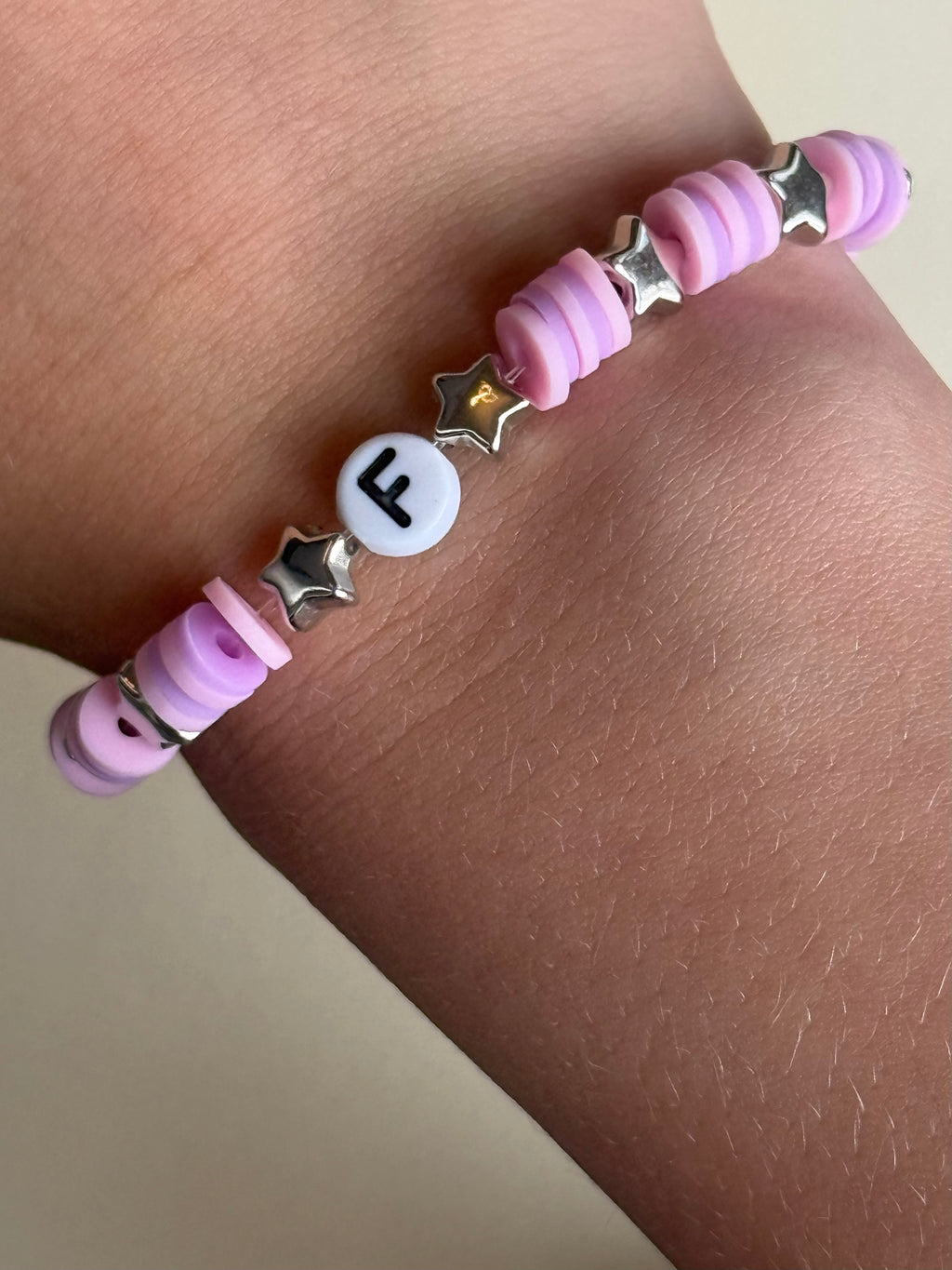 Pink and purple beads, silver stars and letter 'F' size 18cm