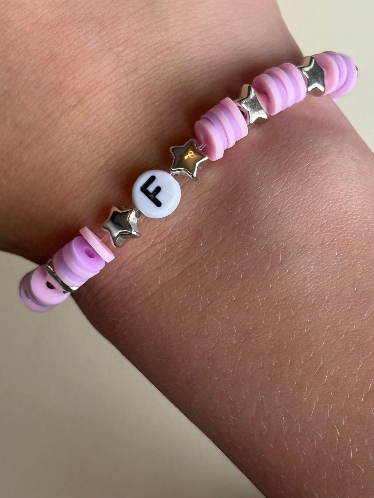 Pink and purple beads, silver stars and letter 'F' size 18cm